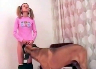 Loli-looking babe seduced by a dog